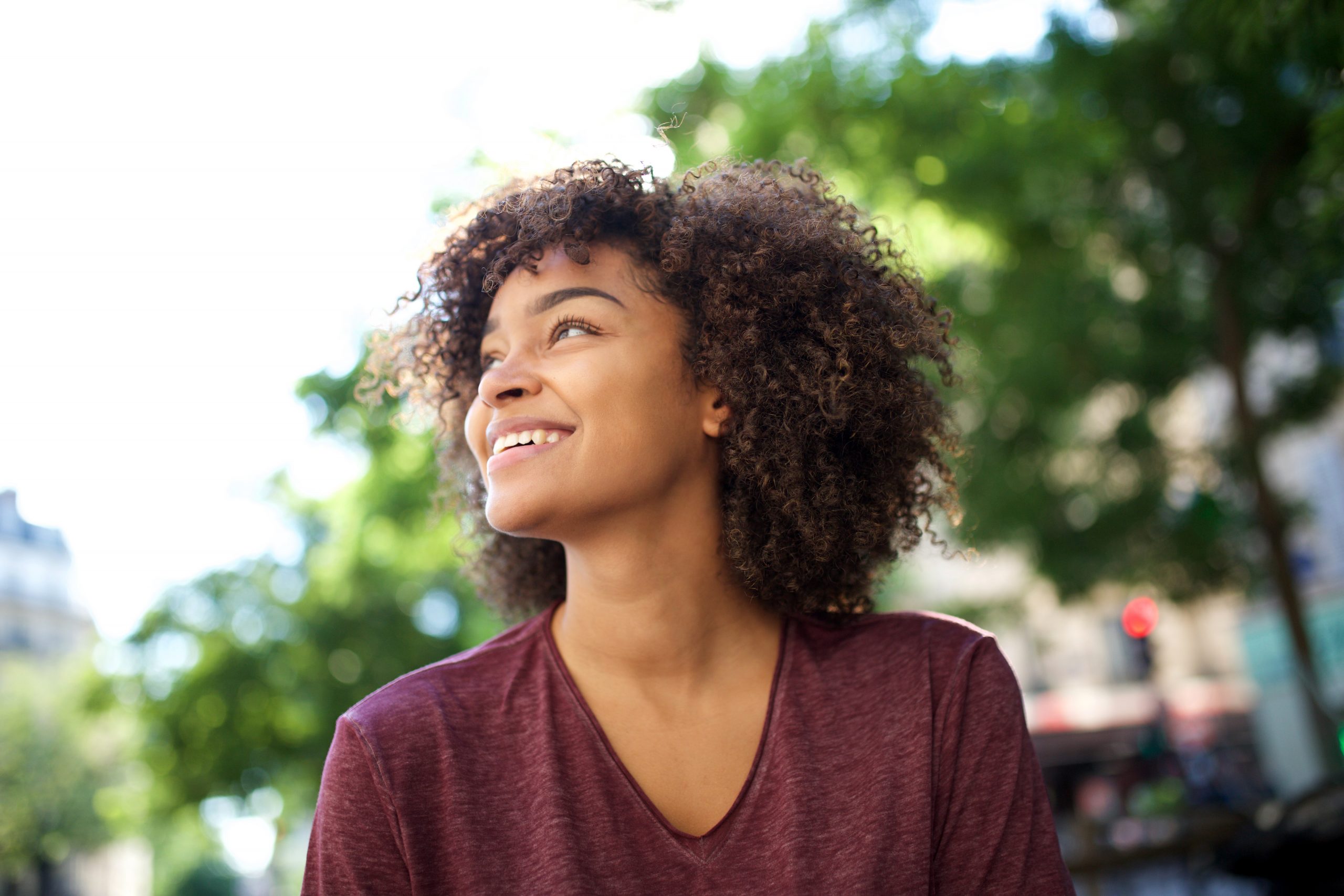 Smiling woman looking up